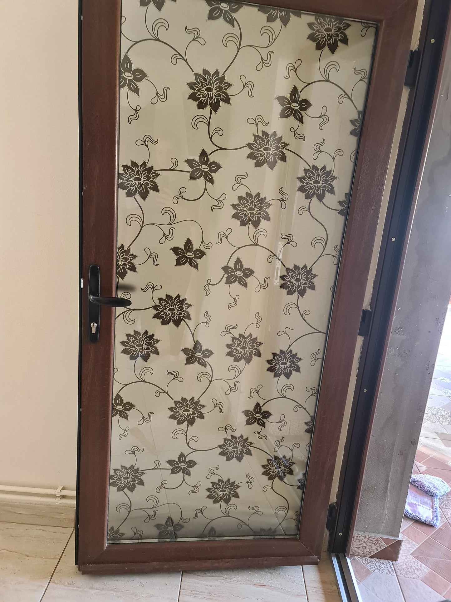 Self-adhesive decorative frosted window film Dora with black floral pattern