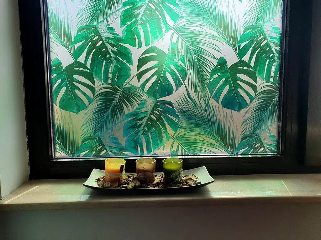Self-adhesive decorative frosted window film Palmas with tropical pattern with green leaves