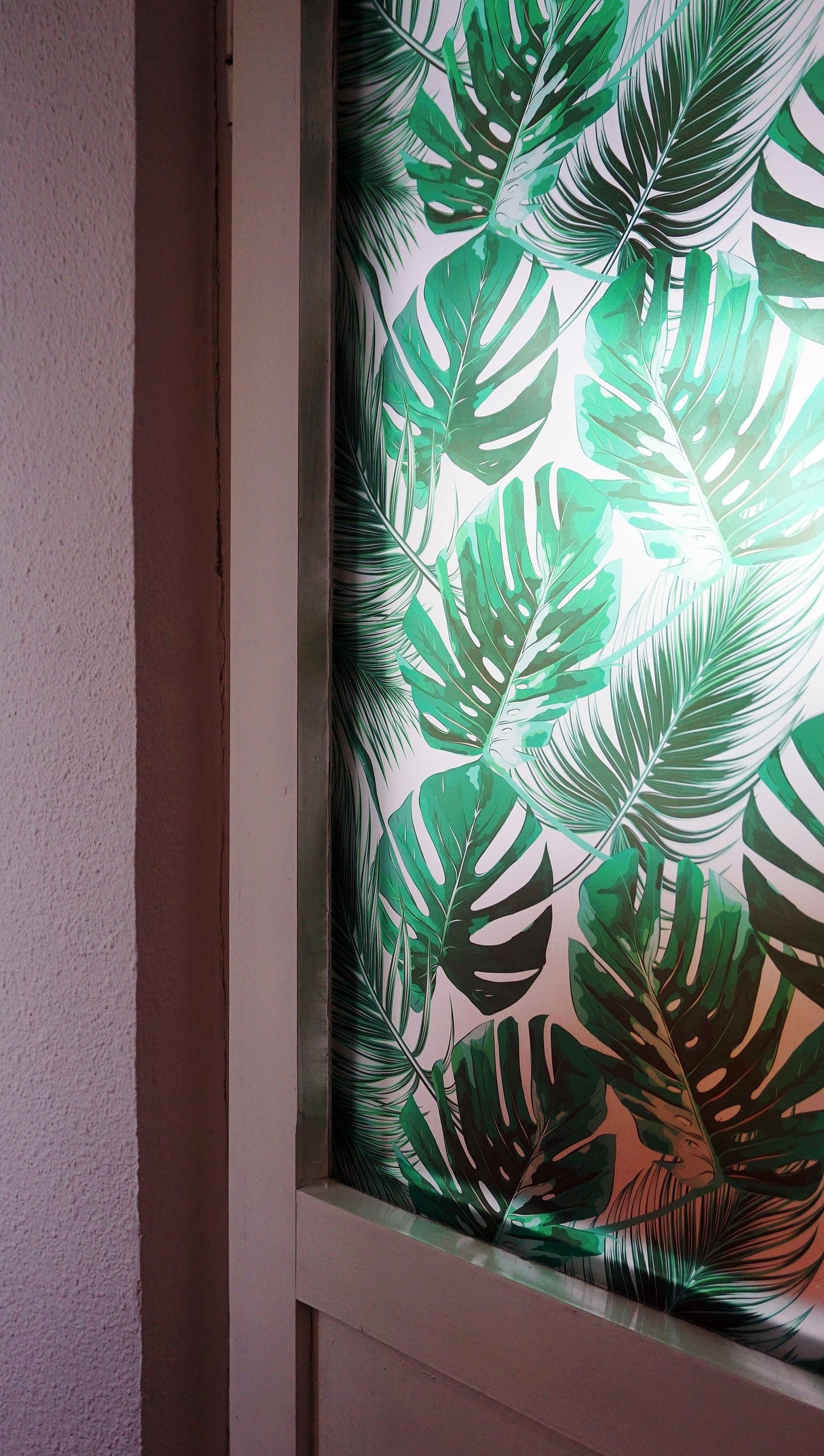 Self-adhesive decorative frosted window film Palmas with tropical pattern with green leaves